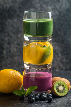 Colorful Healthy Fruit Smoothie on black backgroundの写真素材