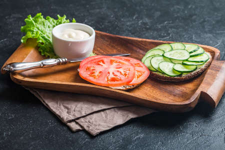 Vegetarian sandwiches with cream cheese and vegatables on black backgroundの写真素材
