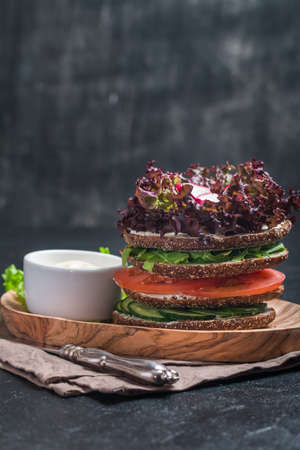 Vegetarian sandwiches with cream cheese and vegatables on black backgroundの写真素材