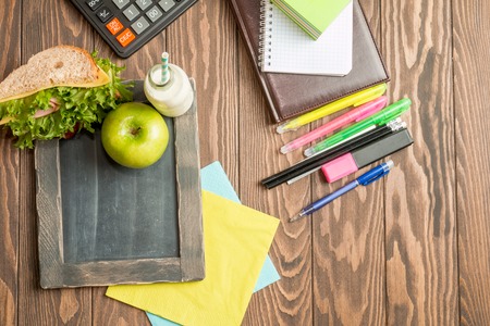 School lunch with sandwich, milk and apple on dark backgroundの写真素材