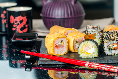 closeup of tray with sushi assorted on the table restaurant japanese sushiの写真素材