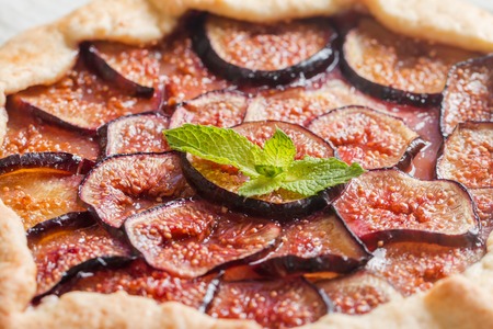 Homemade fresh figs galette on wooden tableの写真素材
