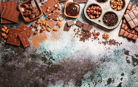 Assortment of different chocolate types on concrete background, top view with copy space.の写真素材