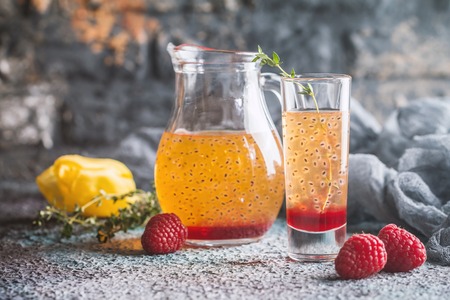 Fresh berry drink with blueberries, raspberries and seedsの写真素材
