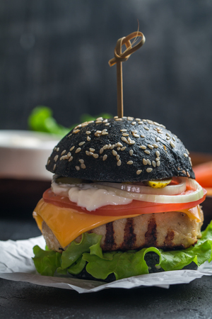 black burger with grilled chicken pattyの写真素材