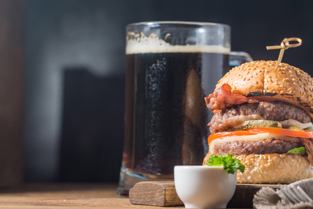 Hamburger and dark beer in vintage styleの写真素材