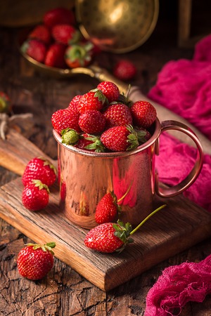 Fresh strawberries in a bowlの写真素材