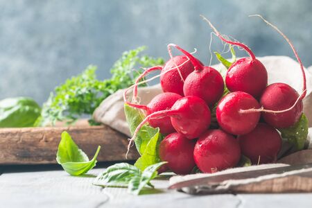 Large bunch of fresh radish on white wooden table, closeupの写真素材
