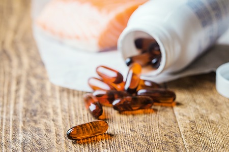 Fish oil capsules with omega 3の写真素材