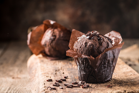 Homemade delicious chocolate muffin on wooden background close-upの写真素材