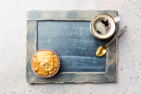 Shot with muffin and coffee cupの写真素材