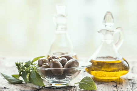 olive oil and olivesの写真素材
