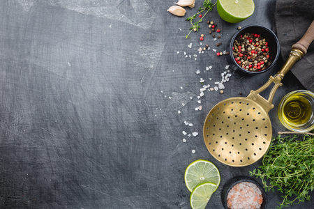 Various seasonings, spices and herbs, ingredients for cooking. Food background on black table top view with copy space.の写真素材