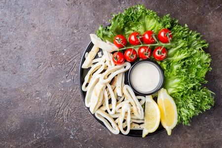 Squid salad and fresh vegetablesの写真素材