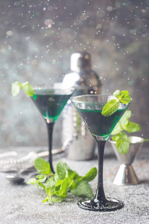 Green cocktails in martini glassesの写真素材