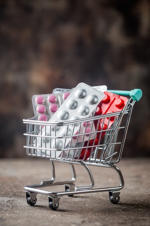 Shopping cart filled with pills.の写真素材