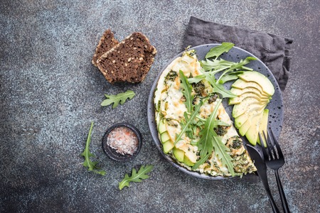 Omelette with avocado and arugula