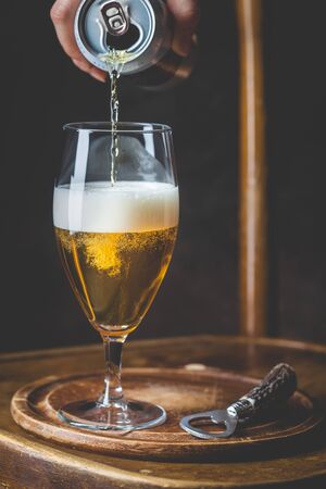 beer pouring into glassの写真素材