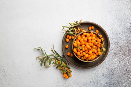 Tea with sea buckthorn on white stone background. top viewの写真素材