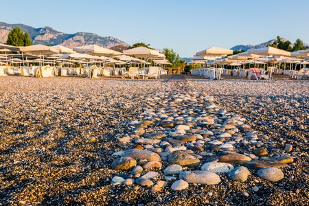 An empty pebble beach on the south coast of Turkey, Kemer in the morningの写真素材