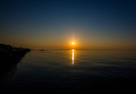 Beautiful sunrise over the horizon in the seaの写真素材
