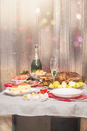 Christmas roast duck with apples served on a festive tableの写真素材