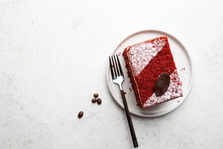 Top view of slice of red velvet cake with copy space on white background.の写真素材
