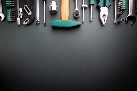 Set of tools over black background, top view with space for textの写真素材