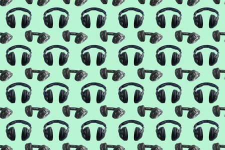 Wireless black headphones on colorful background. Square pattern for different design purposes, seamless flat layの写真素材