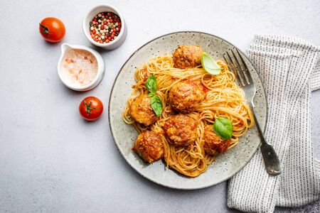 Plate of spaghetti with meatballs in tomato marinara sauce, top viewの写真素材