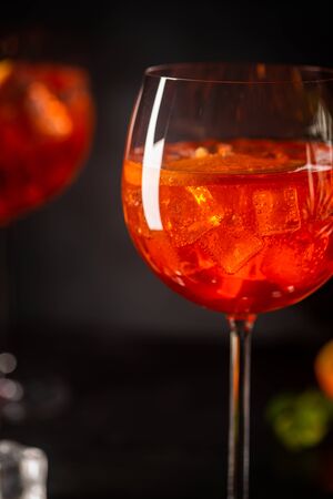 cocktail in glass with fresh orange on dark backgroundの写真素材