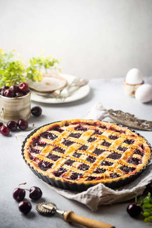 Delicious homemade classic cherry pie with a flaky crust on white backgroundの写真素材