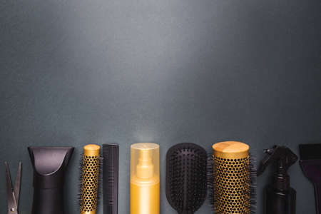 Various hair dresser and cut tools on black background with copy spaceの写真素材