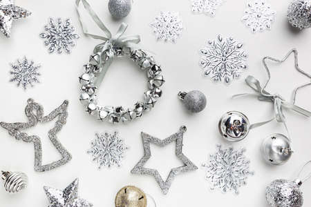 Christmas round composition made of silver winter decorations on white background. Christmas concept. Flat lay, top view.の写真素材