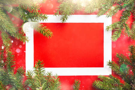 Christmas holidays composition on red background with copy space and frame for your text