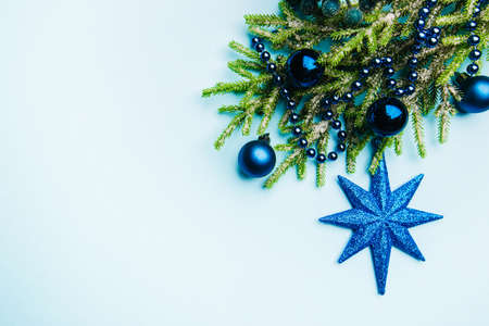 Christmas holidays composition with christmas decorations on blue background with copy space for your textの写真素材