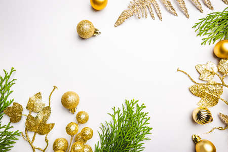 Christmas holidays composition with gold decorations on white background with copy space for your...