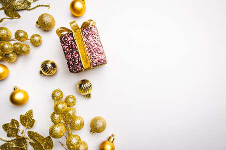 Christmas holidays composition with gold decorations on white background with copy space for your...