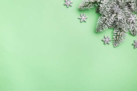 Christmas holidays composition with christmas decorations and fir tree branches on green background...