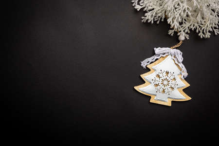 Christmas holidays composition with christmas decorations and fir tree branches on black background with copy space for your textの写真素材