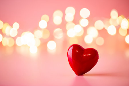 The red Heart shapes on abstract light pink glitter background. Love concept for valentines day.の写真素材