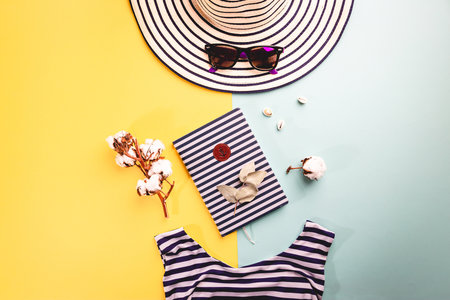 Summer holiday flat lay, Womans accessories on colorful background, Vacation, summer and travel itemsの写真素材