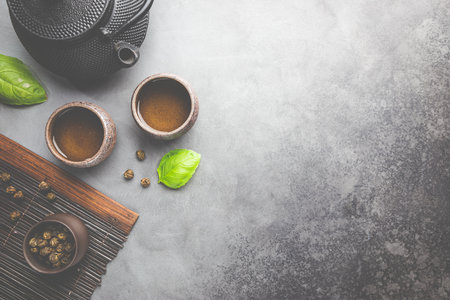 Green japanese tea on black stone table. Top view with copy spaceの写真素材