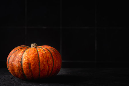 Colorful halloween pumpkins on dark background Autumn decorの写真素材
