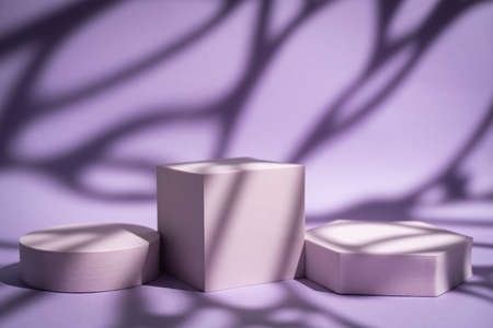 Abstract minimalistic scene with geometric forms. podium on purple background with shadows. product presentation, mock up, show cosmetic product display, Podium, stage pedestal or platform.の写真素材