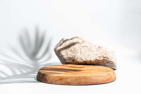 Wooden podium with leaves shadows. Realistic wood platform for product presentation. Minimal nature...