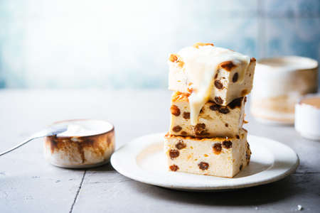 Baked homemade cottage cheese casserole or pudding with raisins on white background. Close-up.の写真素材
