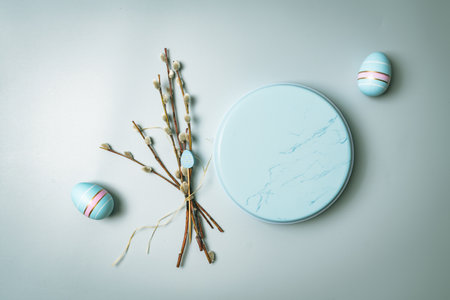 Happy Easter composition for easter design. Elegant Easter eggs with willow branches on pastel blue...