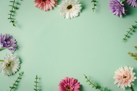 Bright summer background with pink, purple and white gerbera flowers and green leaves on green backgroundの写真素材