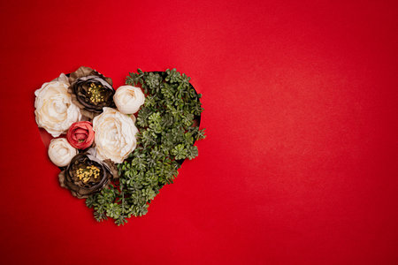 Red Heart On Red Paper Background For Happy San Valentine Day. Valentines Day festive banner with ribbons and flowersの写真素材
